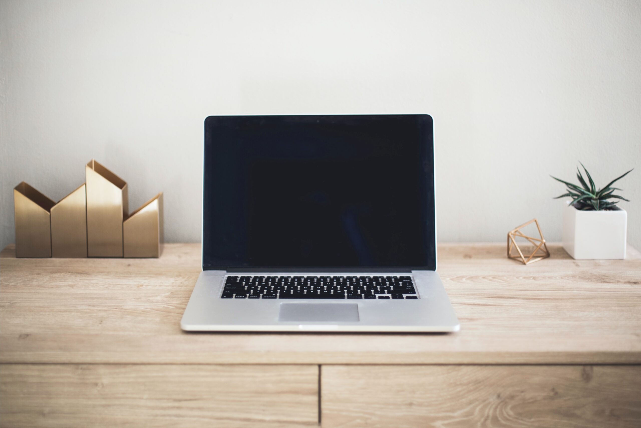 Photo of a phone and a laptop